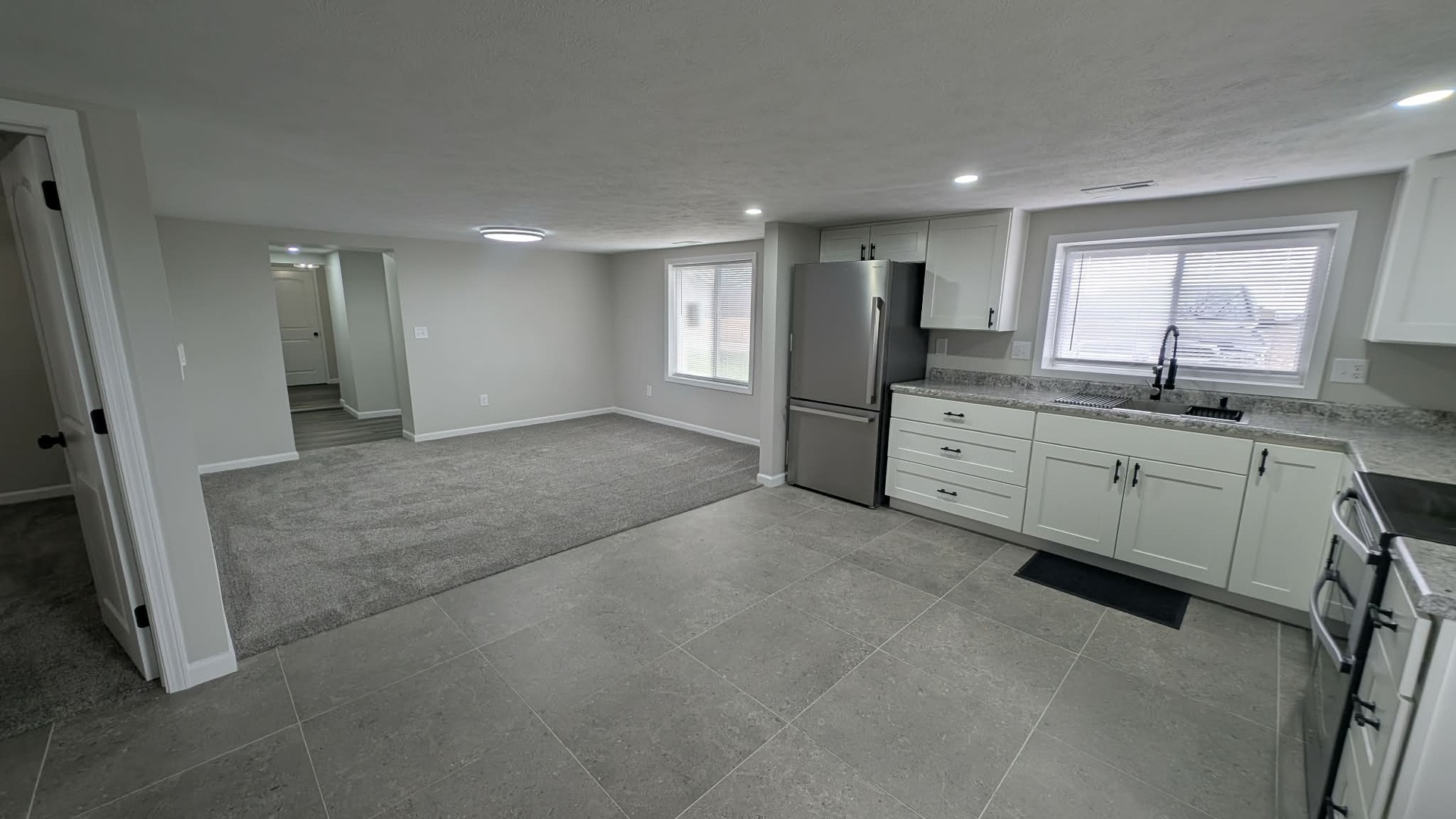 720 East Marion Street Clinton, IL 61727 - Photo 2 of 22 a view of a kitchen with a sink a window and cabinets