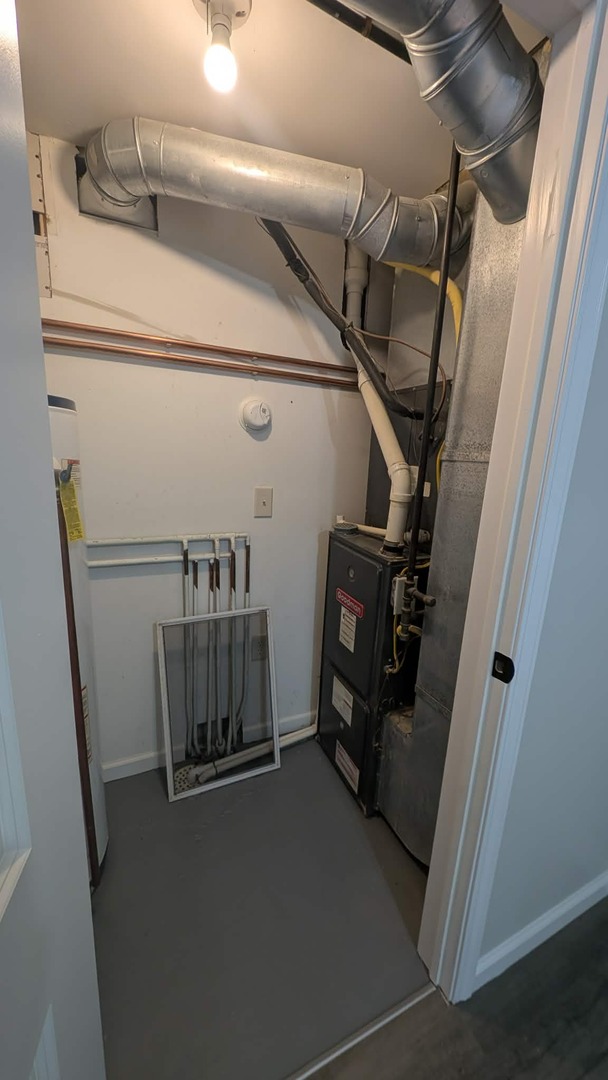 720 East Marion Street Clinton, IL 61727 - Photo 22 of 22 a view of walk in closet with clothes and shoes