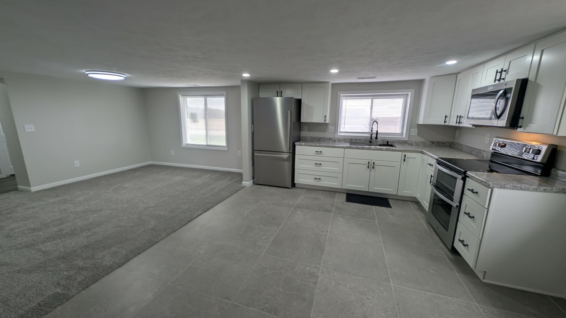 720 East Marion Street Clinton, IL 61727 - Photo 5 of 22 a kitchen with lot of cabinets and refrigerator
