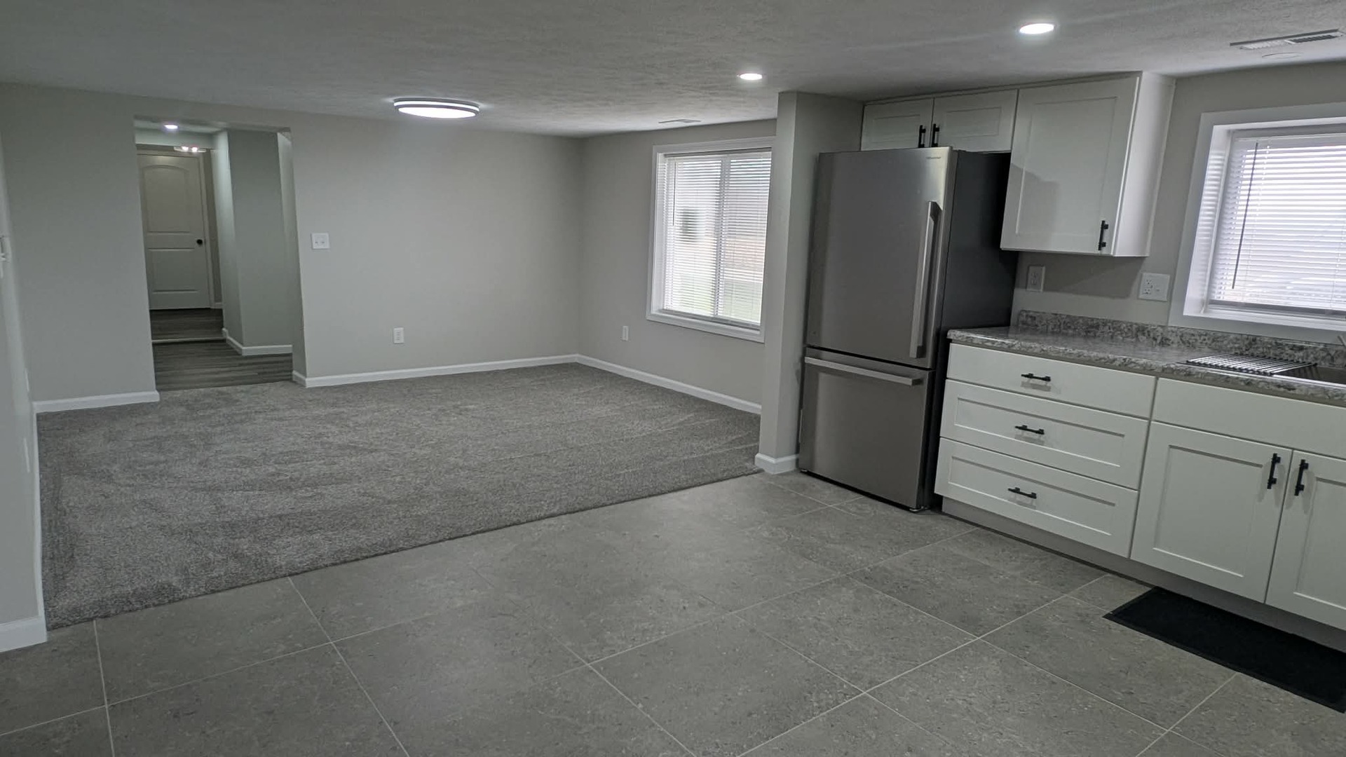720 East Marion Street Clinton, IL 61727 - Photo 6 of 22 a kitchen with stainless steel appliances granite countertop a refrigerator and a stove top oven