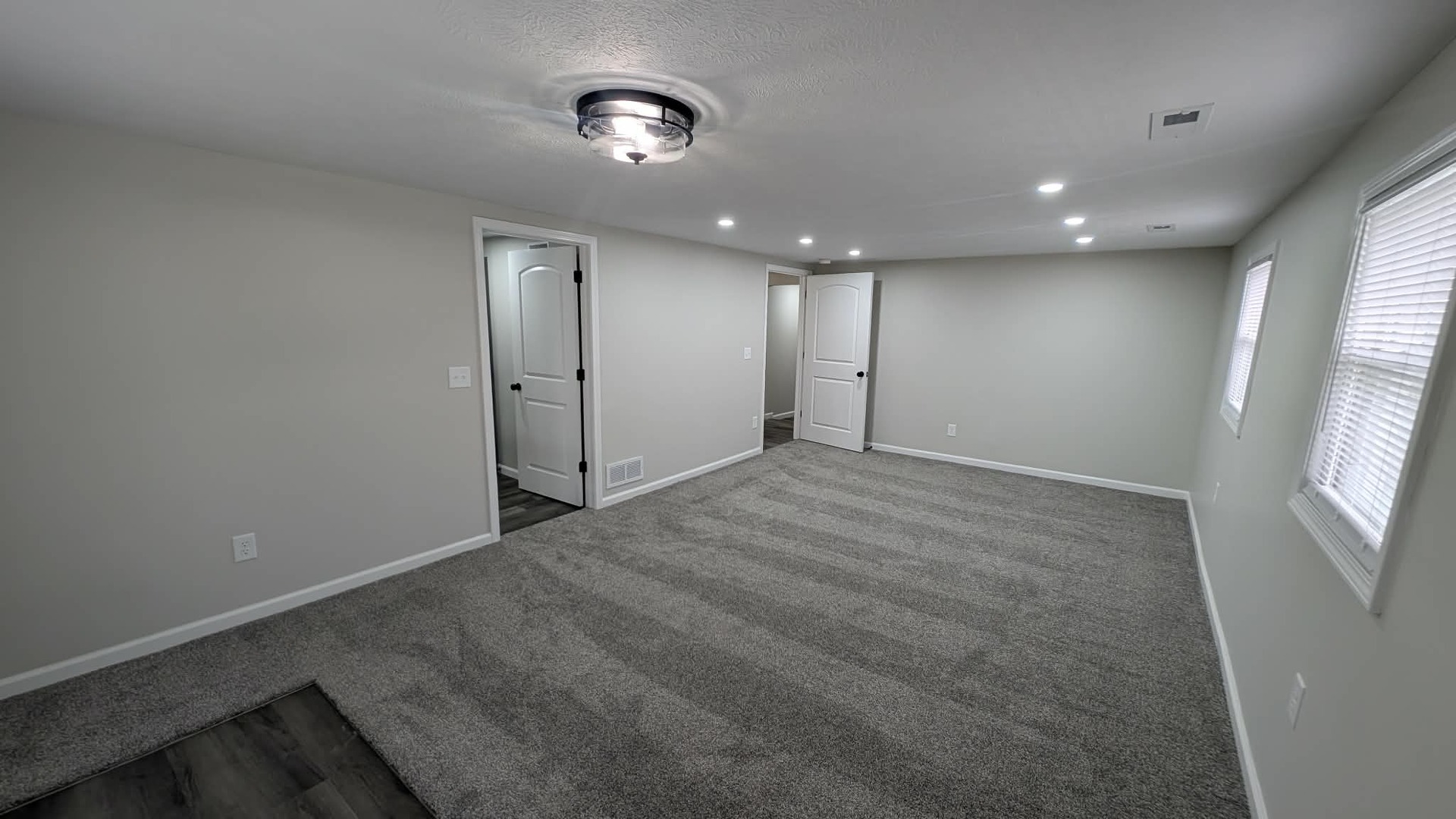 720 East Marion Street Clinton, IL 61727 - Photo 9 of 22 an empty room with windows and pillars in it
