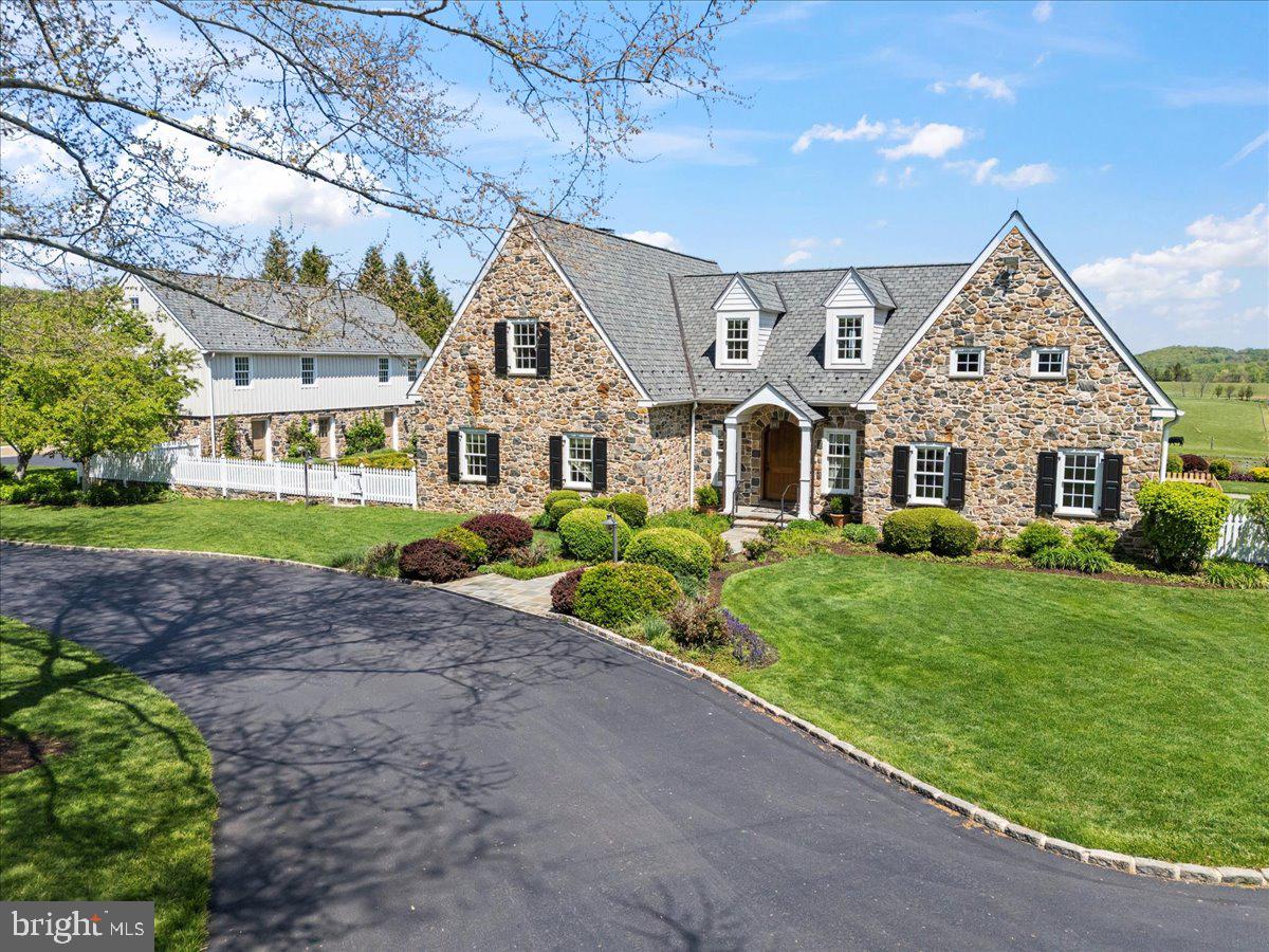 182 Trythall Road Elverson, PA 19520 - Photo 1 of 76 a front view of a house with a yard
