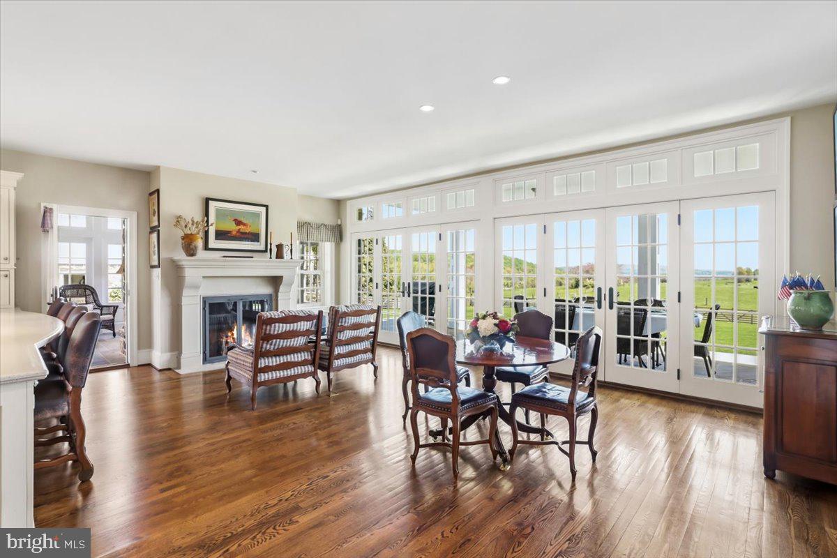 182 Trythall Road Elverson, PA 19520 - Photo 14 of 76 a living room with furniture a large window and wooden floor