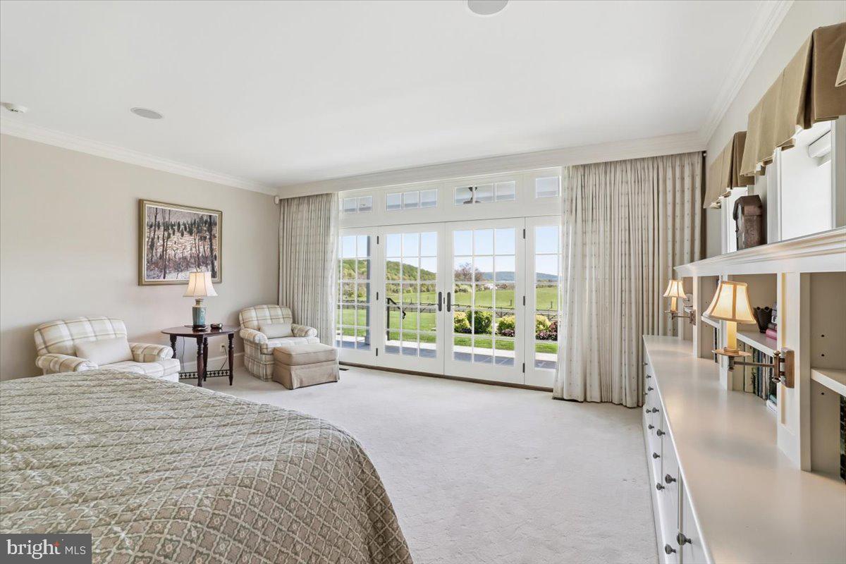182 Trythall Road Elverson, PA 19520 - Photo 16 of 76 a large bedroom with a bed and a large window