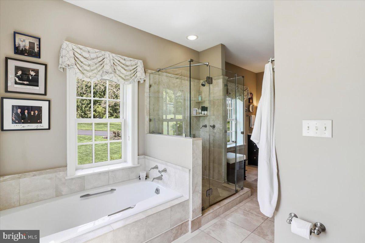 182 Trythall Road Elverson, PA 19520 - Photo 19 of 76 a bathroom with a bathtub and a shower