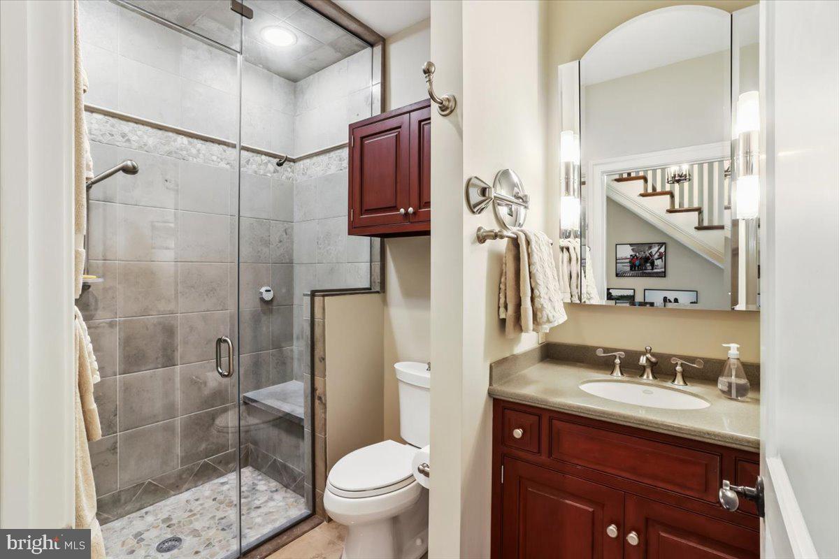 182 Trythall Road Elverson, PA 19520 - Photo 27 of 76 a bathroom with a granite countertop sink toilet and shower
