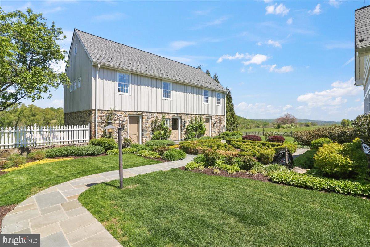 182 Trythall Road Elverson, PA 19520 - Photo 47 of 76 a view of a house with backyard and porch