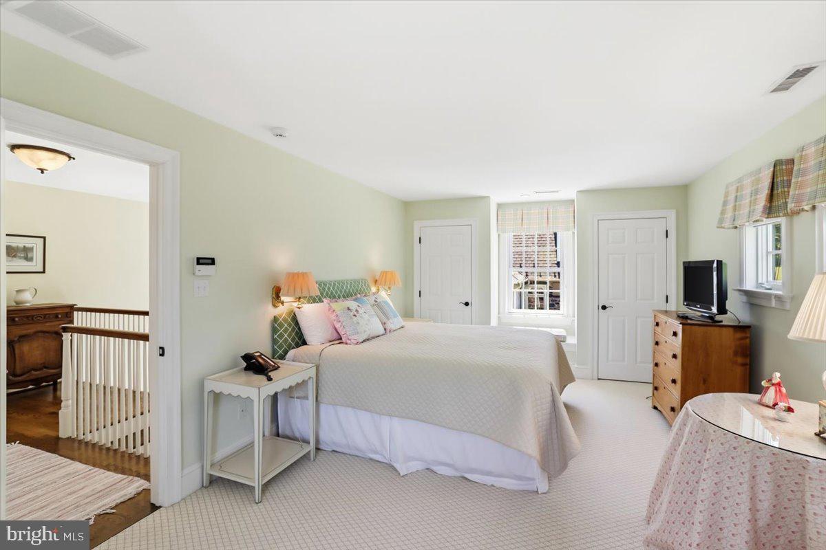 182 Trythall Road Elverson, PA 19520 - Photo 53 of 76 a bedroom with a bed and a dresser in it