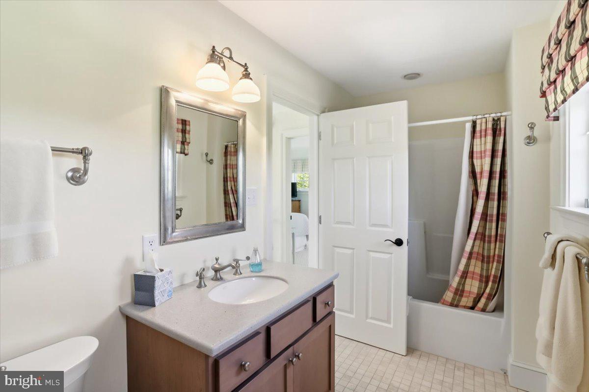 182 Trythall Road Elverson, PA 19520 - Photo 55 of 76 a bathroom with a sink a toilet and a mirror