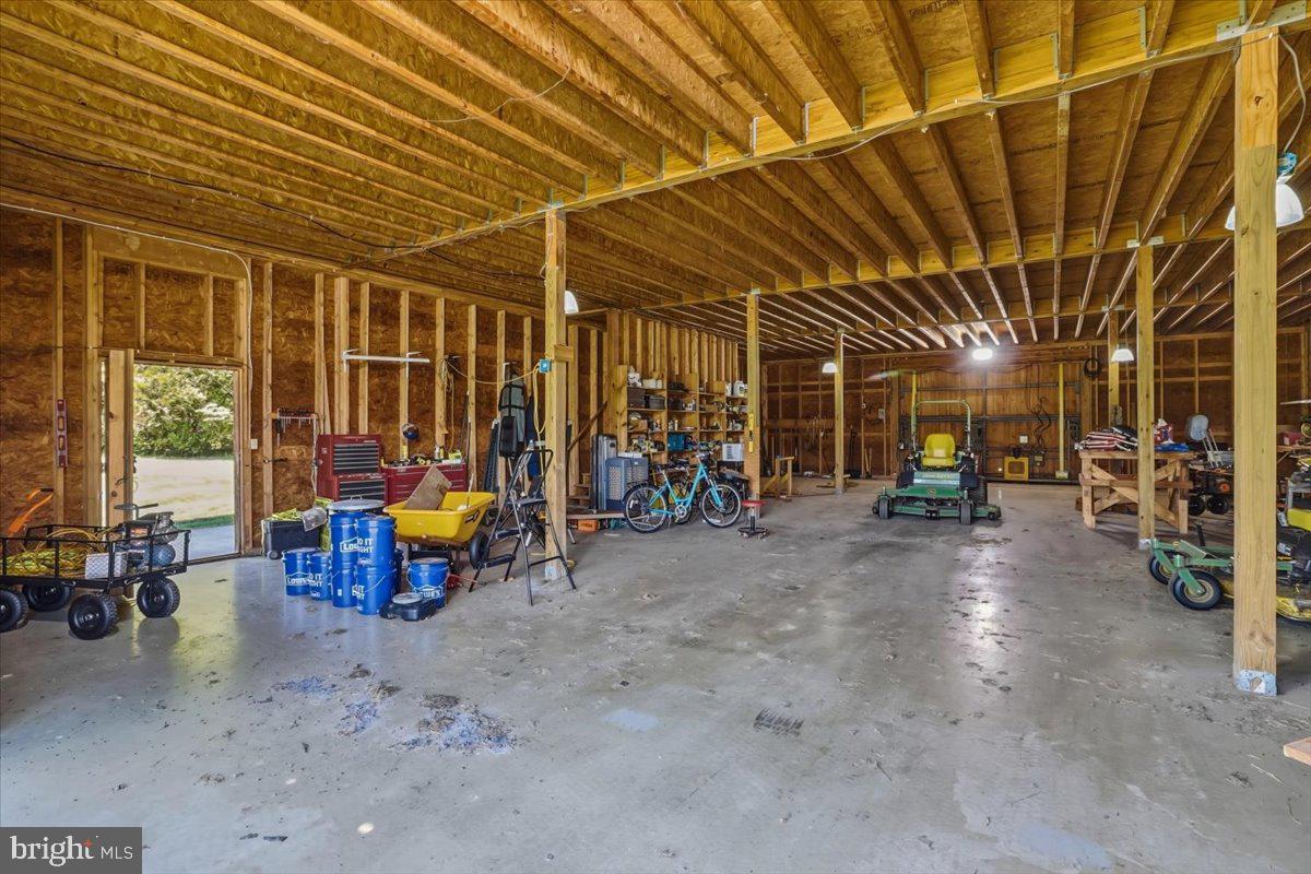 182 Trythall Road Elverson, PA 19520 - Photo 62 of 76 a view of a garage with a table and chairs