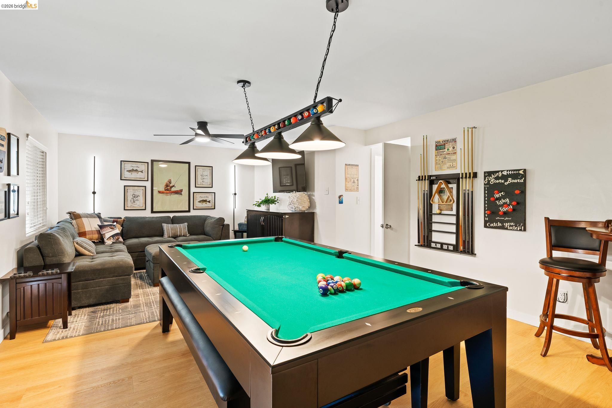 1704 Taylor Road Bethel Island, CA 94511 - Photo 15 of 73 Recreational room featuring a billiard table with overhead lighting, wood-finish flooring, a ceiling fan, and a built-in wet bar