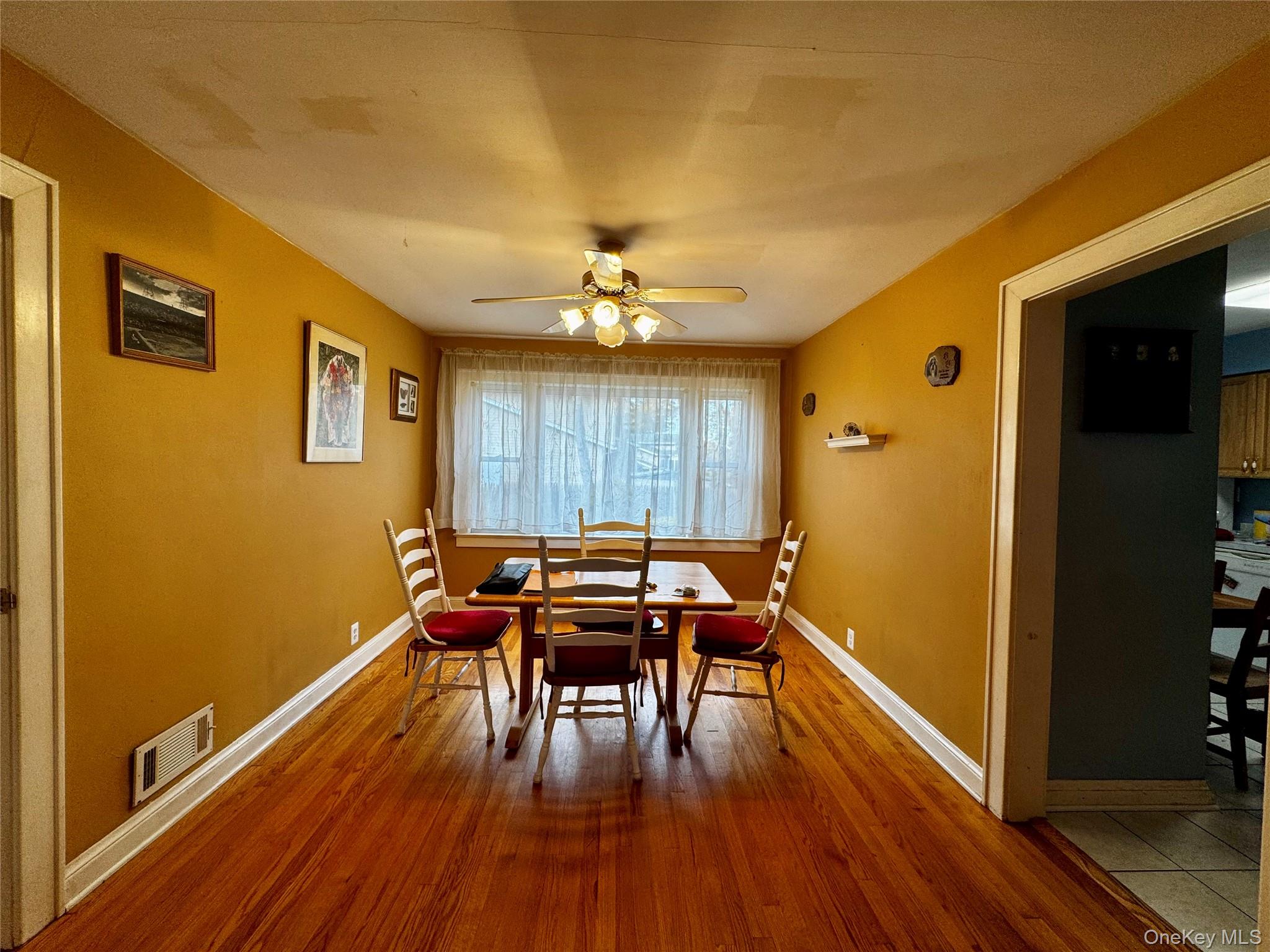 351 Nicolls Road Deer Park, NY 11729 - Photo 4 of 16 a view of a livingroom with furniture and wooden floor