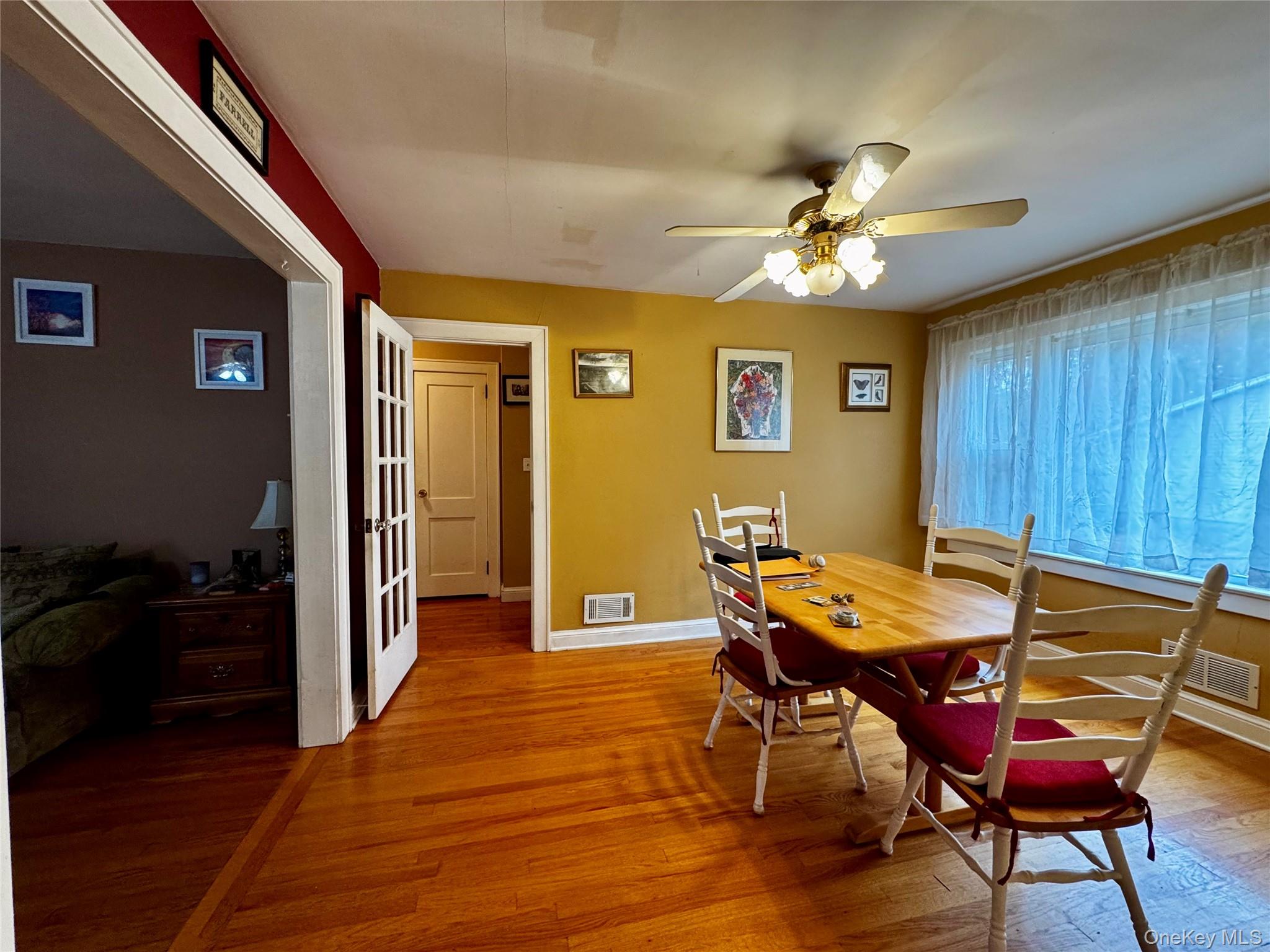 351 Nicolls Road Deer Park, NY 11729 - Photo 5 of 16 a view of a dining room with furniture and wooden floor