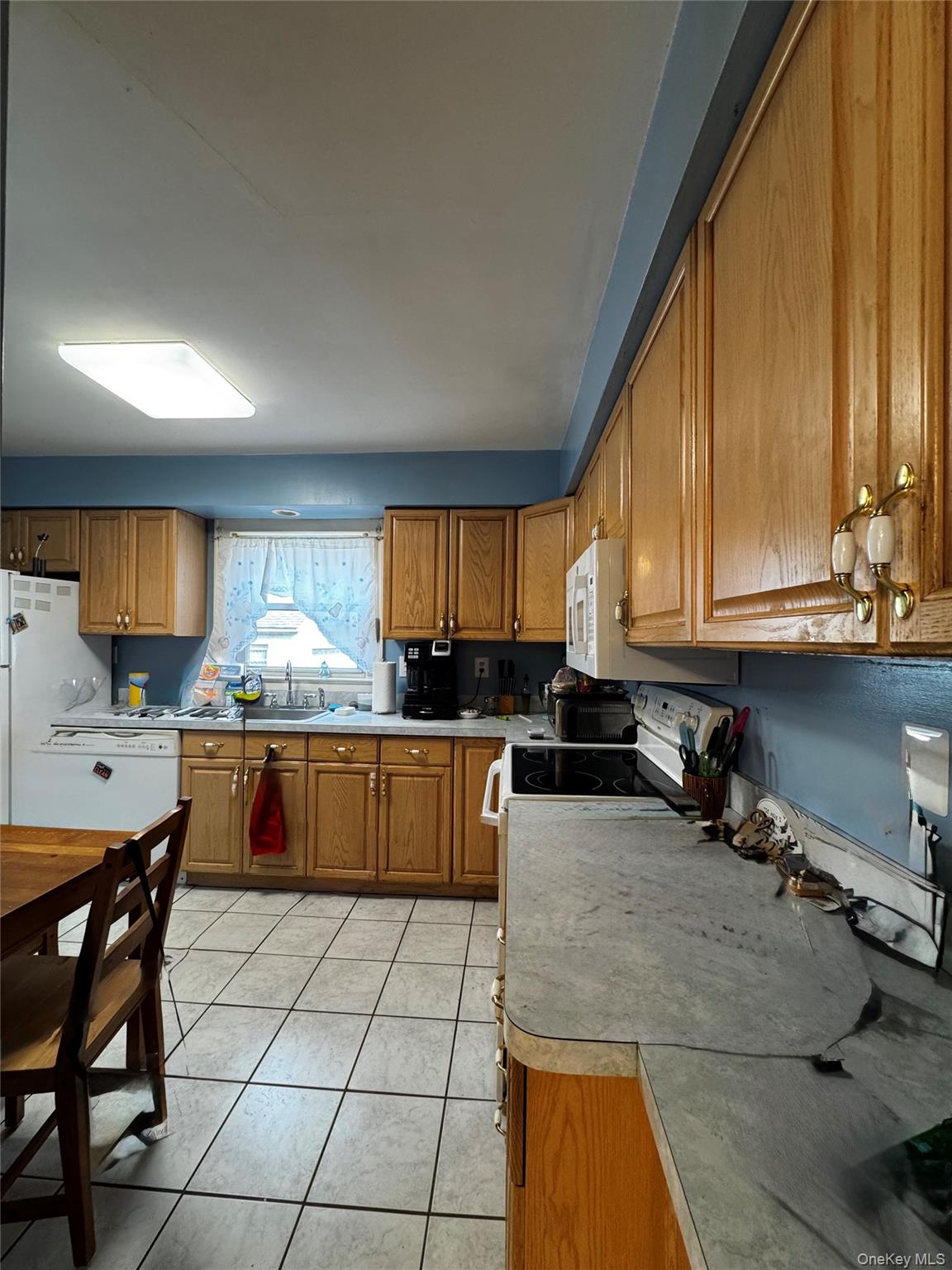 351 Nicolls Road Deer Park, NY 11729 - Photo 7 of 16 a kitchen with a sink and cabinets