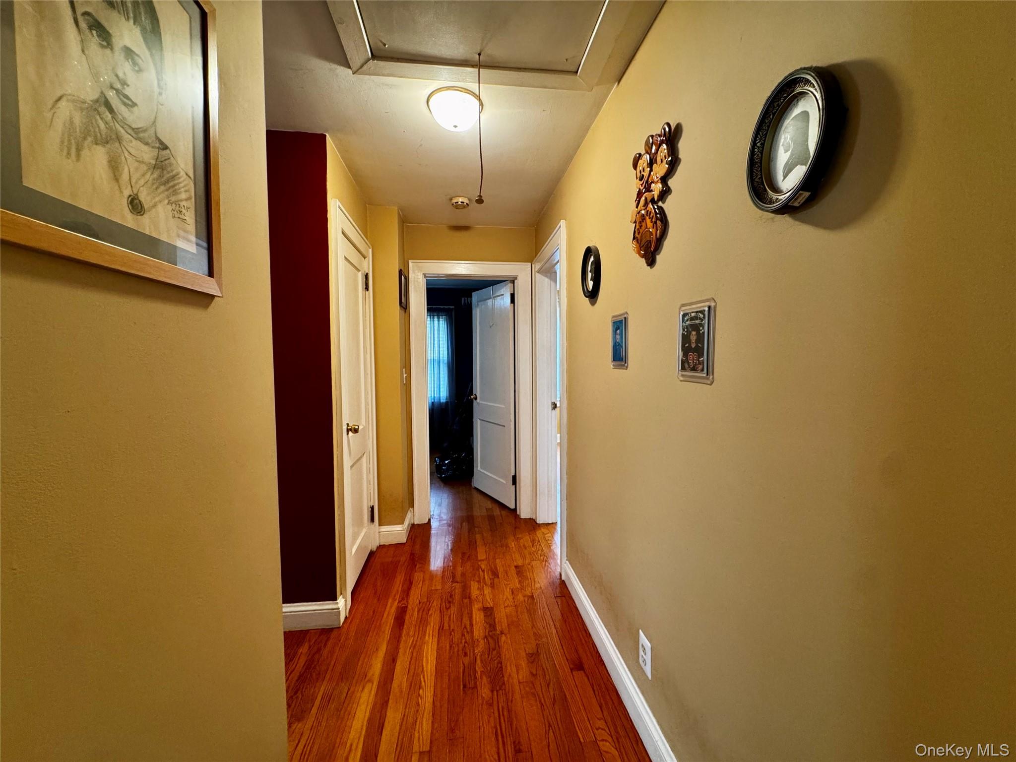 351 Nicolls Road Deer Park, NY 11729 - Photo 8 of 16 a view of a hallway with wooden floor