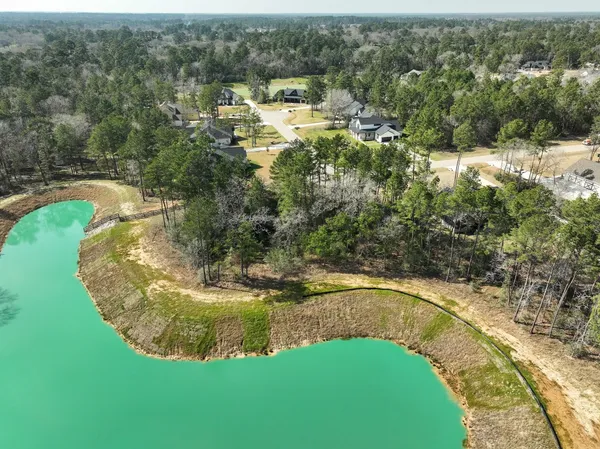 a view of a swimming pool with a yard