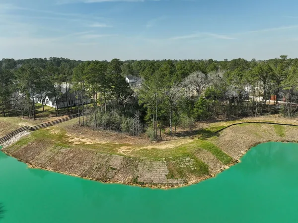 a view of a swimming pool with a yard