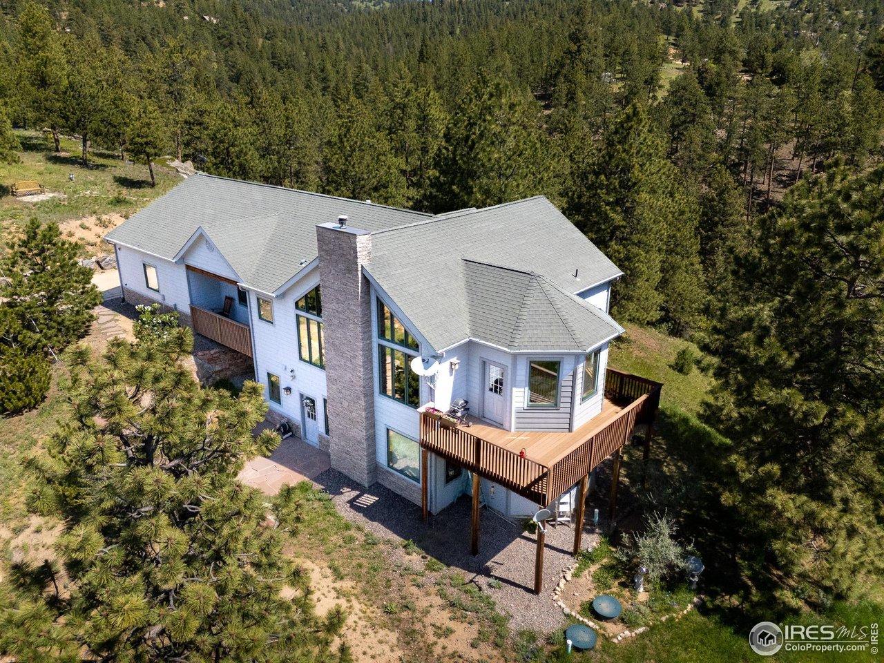 237 Puma Drive Boulder, CO 80302 - Photo 34 of 40 Asphalt fire resistant shingles and trex composite decking.