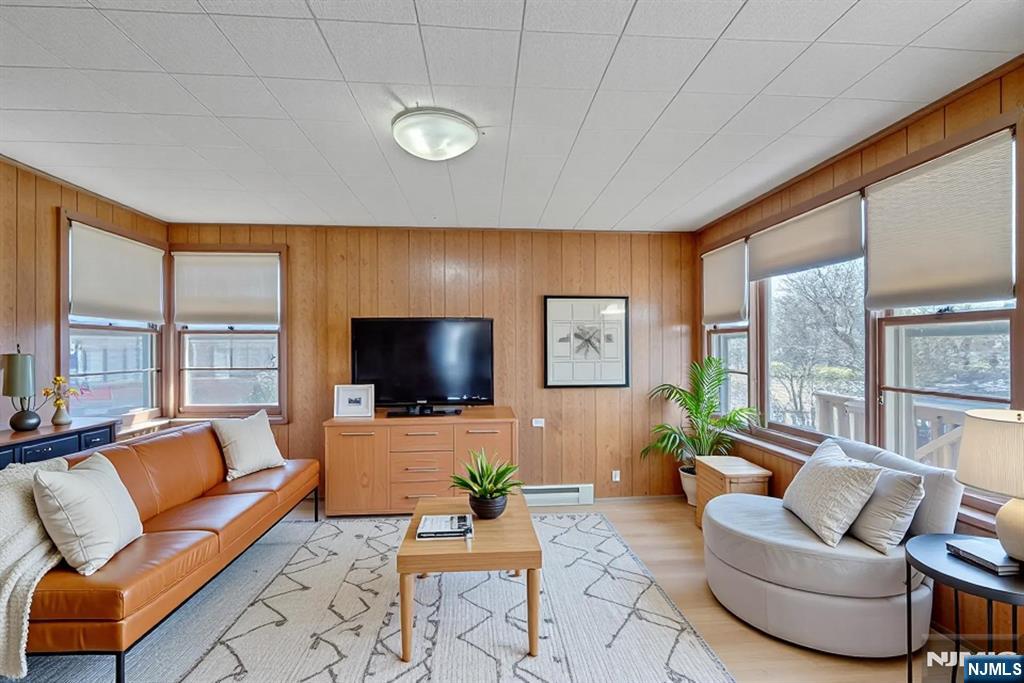 90 Arnot Place Paramus, NJ 07652 - Photo 12 of 32 a living room with furniture and a flat screen tv