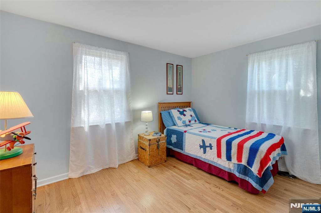 90 Arnot Place Paramus, NJ 07652 - Photo 16 of 32 a bedroom with a bed and window
