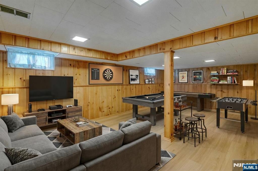 90 Arnot Place Paramus, NJ 07652 - Photo 20 of 32 a living room with furniture and a flat screen tv