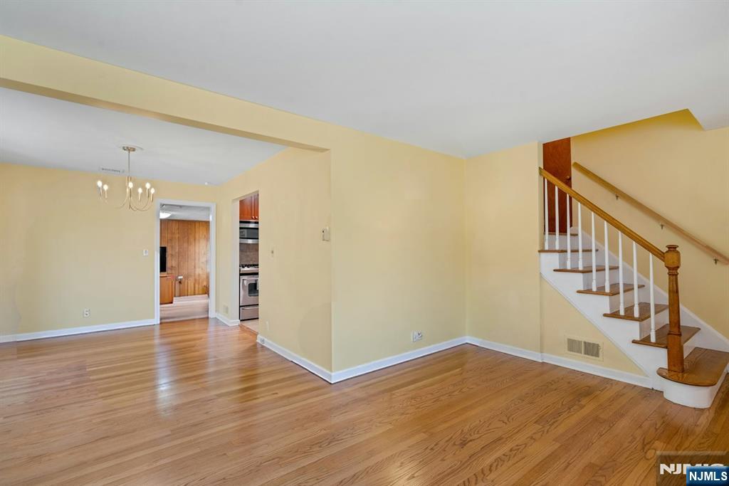 90 Arnot Place Paramus, NJ 07652 - Photo 4 of 32 a view of an empty room with wooden floor