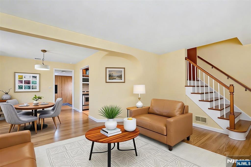 90 Arnot Place Paramus, NJ 07652 - Photo 5 of 32 a living room with fireplace furniture and a wooden floor