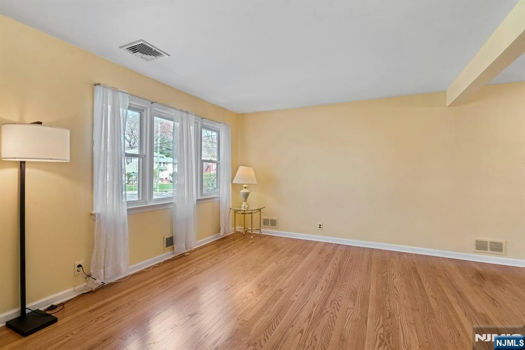 90 Arnot Place Paramus, NJ 07652 - Photo 7 of 32 a view of empty room with wooden floor and fan