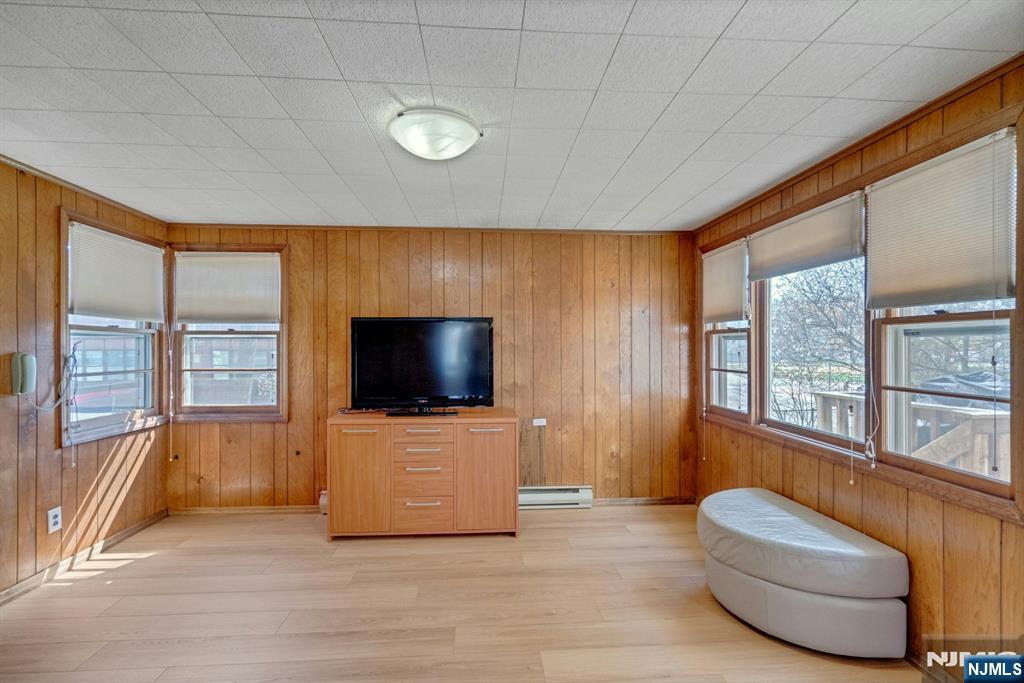 90 Arnot Place Paramus, NJ 07652 - Photo 10 of 32 a living room with furniture and a flat screen tv