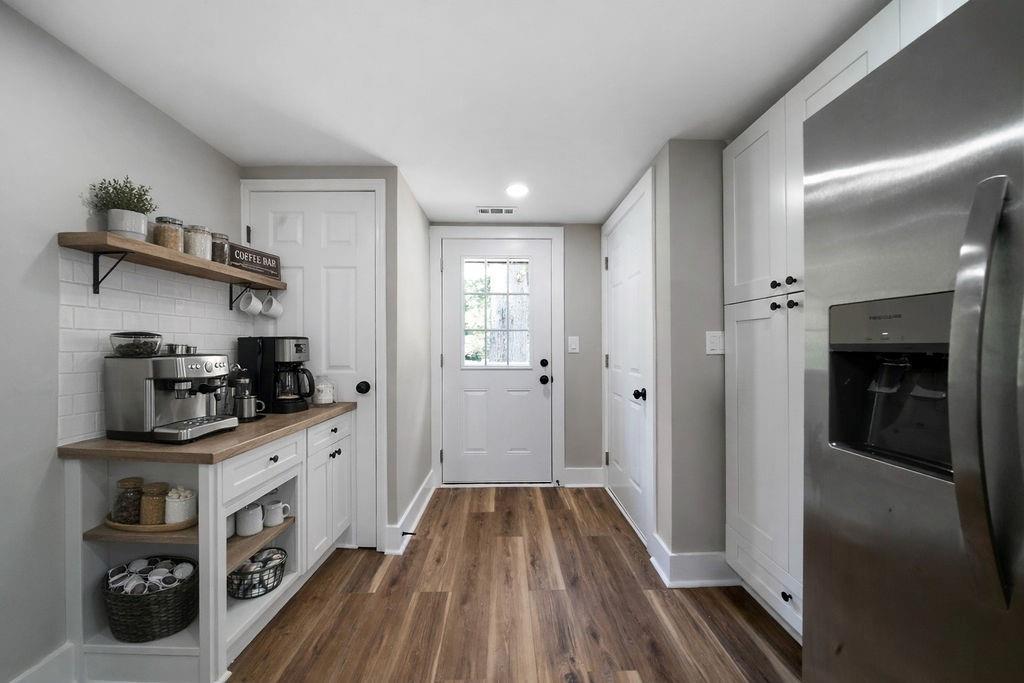 6488 Nebo Road Hiram, GA 30141 - Photo 13 of 32 a kitchen with cabinets and wooden floor