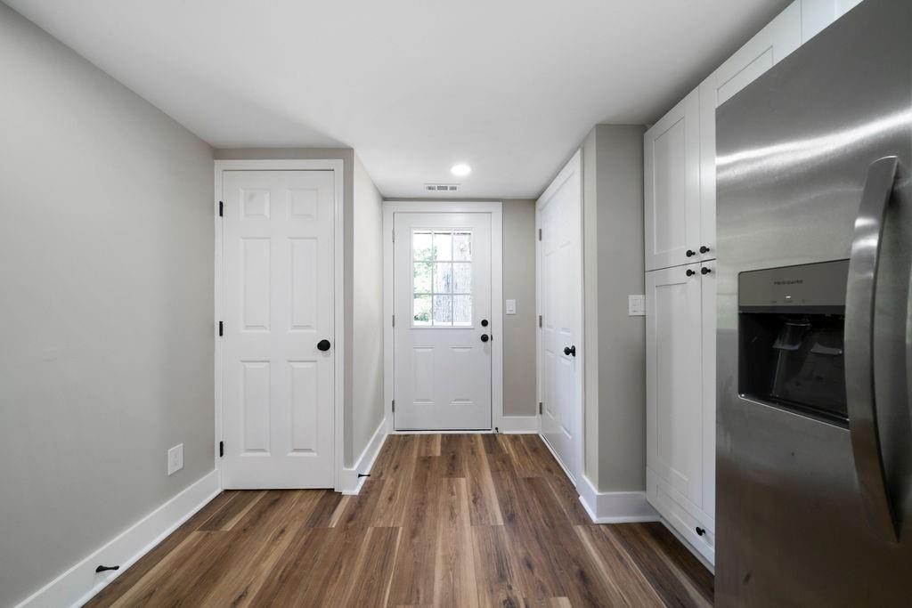 6488 Nebo Road Hiram, GA 30141 - Photo 14 of 32 a view of a hallway with wooden floor and closet