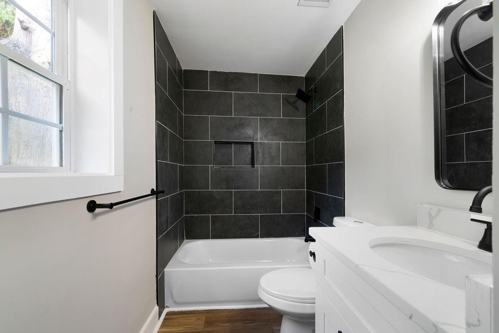 6488 Nebo Road Hiram, GA 30141 - Photo 24 of 32 a bathroom with a sink toilet and shower