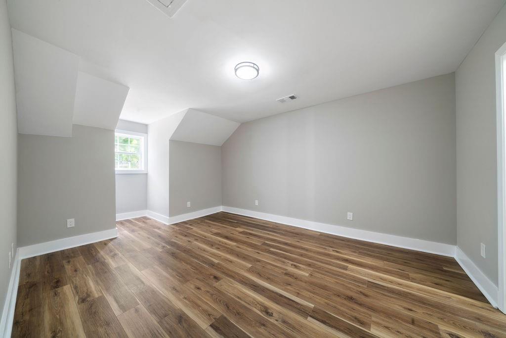 6488 Nebo Road Hiram, GA 30141 - Photo 25 of 32 an empty room with wooden floor and windows