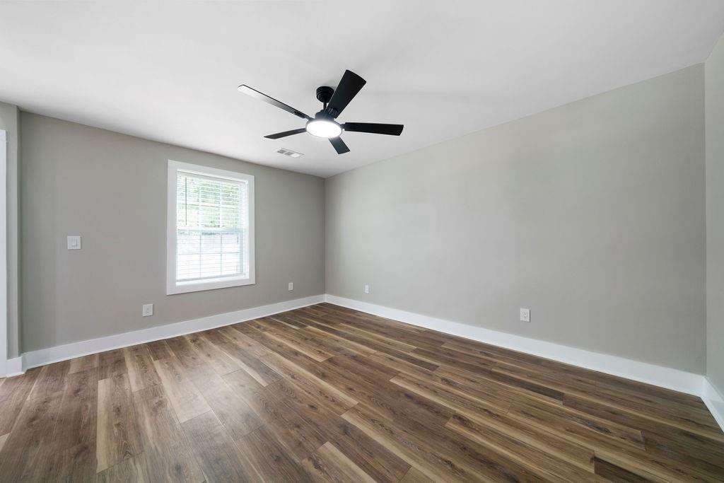 6488 Nebo Road Hiram, GA 30141 - Photo 8 of 32 an empty room with wooden floor and windows