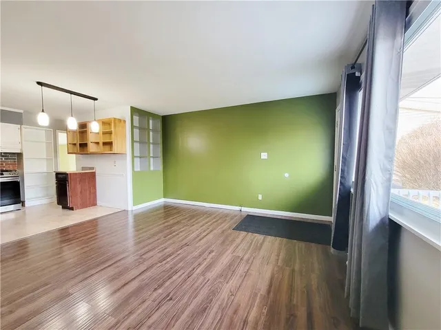a view of a livingroom with wooden floor