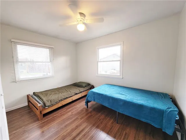 a room with a bed and window