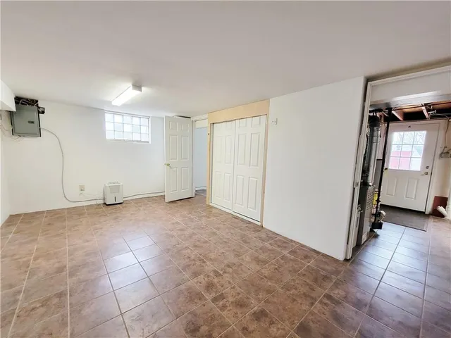 a view of an empty room and a window