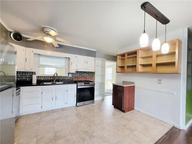 a kitchen with a stove and a refrigerator