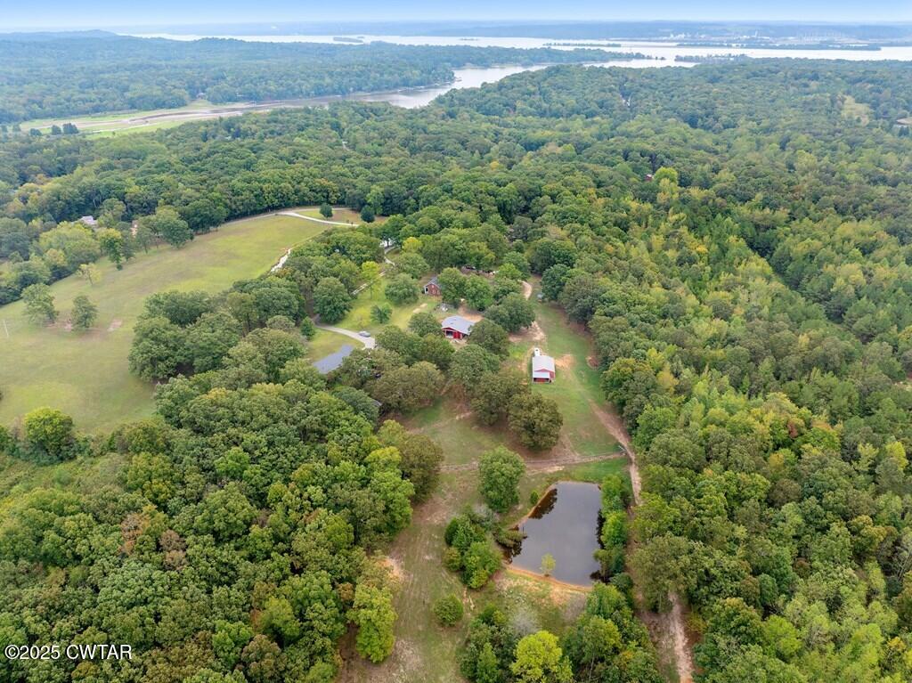 255 Hartley Road Camden, TN 38320 - Photo 16 of 79 an aerial view of residential houses with outdoor space and trees