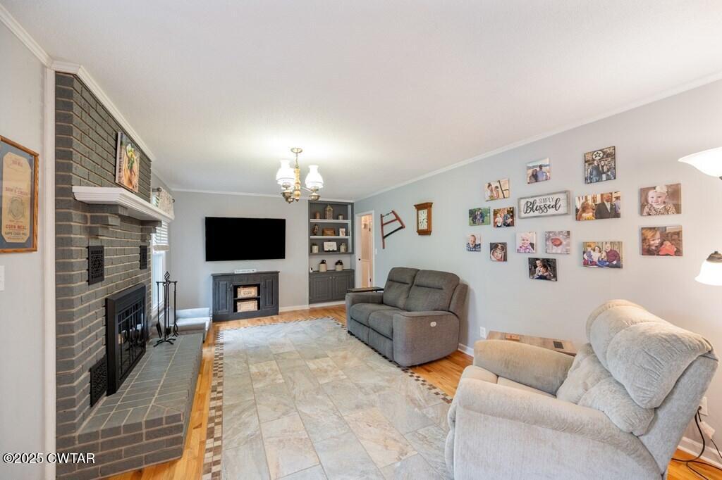 255 Hartley Road Camden, TN 38320 - Photo 26 of 79 a living room with furniture and a flat screen tv