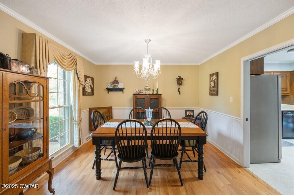 255 Hartley Road Camden, TN 38320 - Photo 35 of 79 a view of a dining room with furniture window and wooden floor