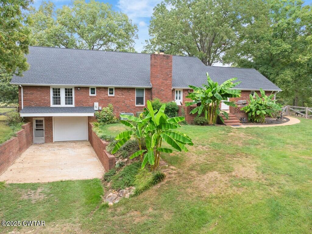 255 Hartley Road Camden, TN 38320 - Photo 6 of 79 front view of a house with a yard
