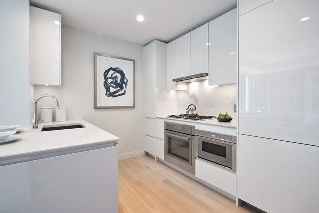 a kitchen with a stove and a sink