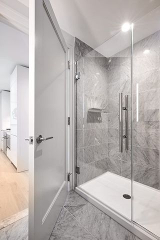 a bathroom with a shower and a bath tub