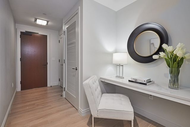 a view of a room that has a table and chair