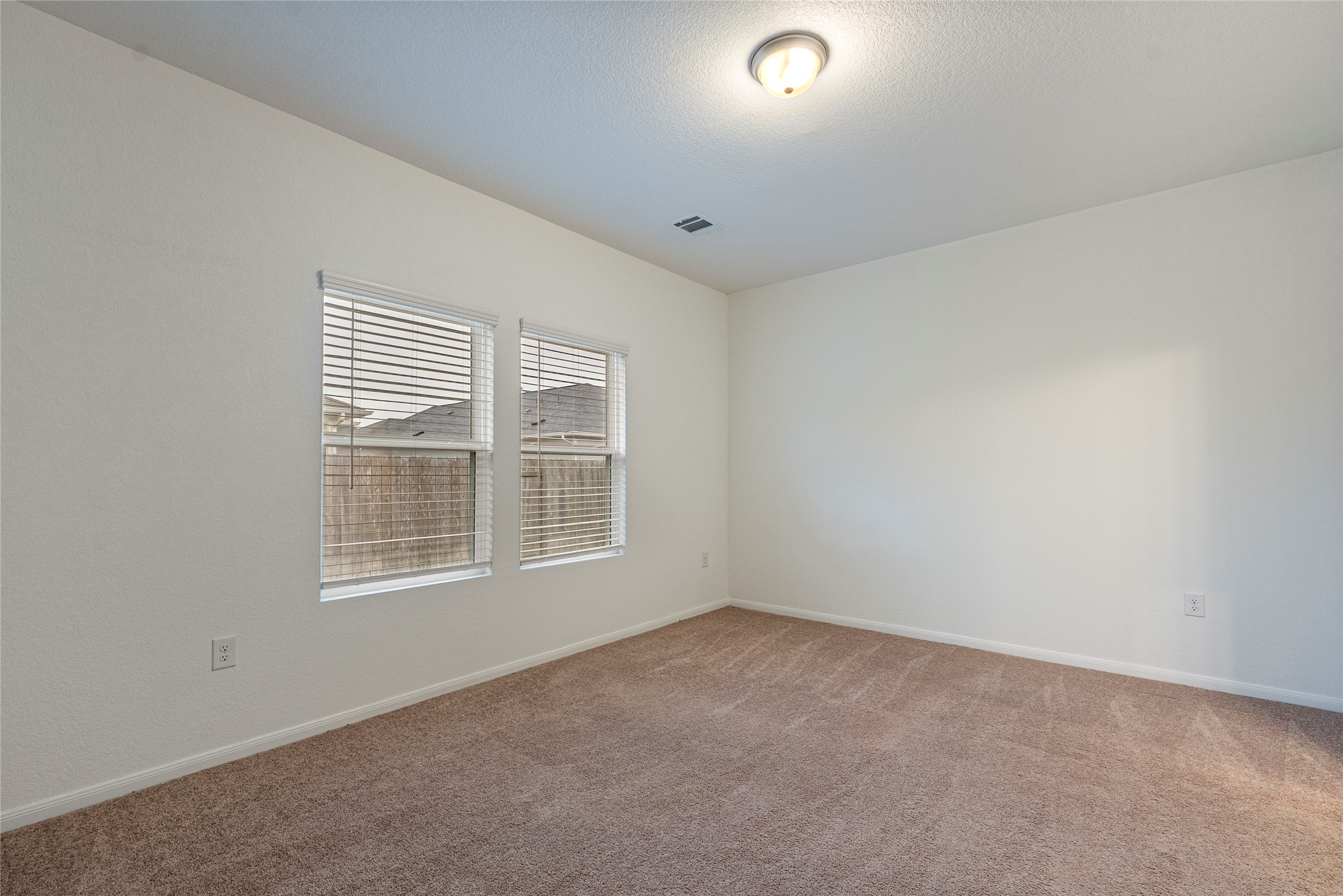 149 Biscayne Drive Kyle, TX 78640 - Photo 7 of 20 an empty room with a window