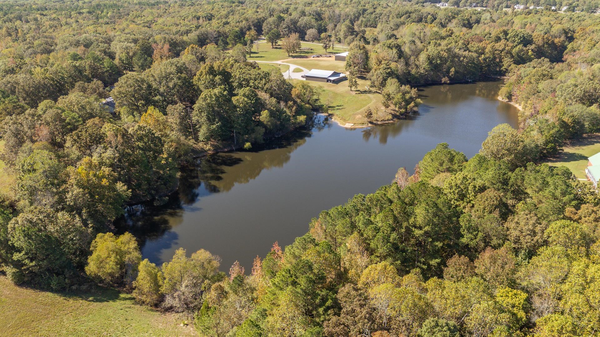 0 Cliffview Road Bolivar, TN 38008 - Photo 3 of 23 a view of a lake with lawn chairs