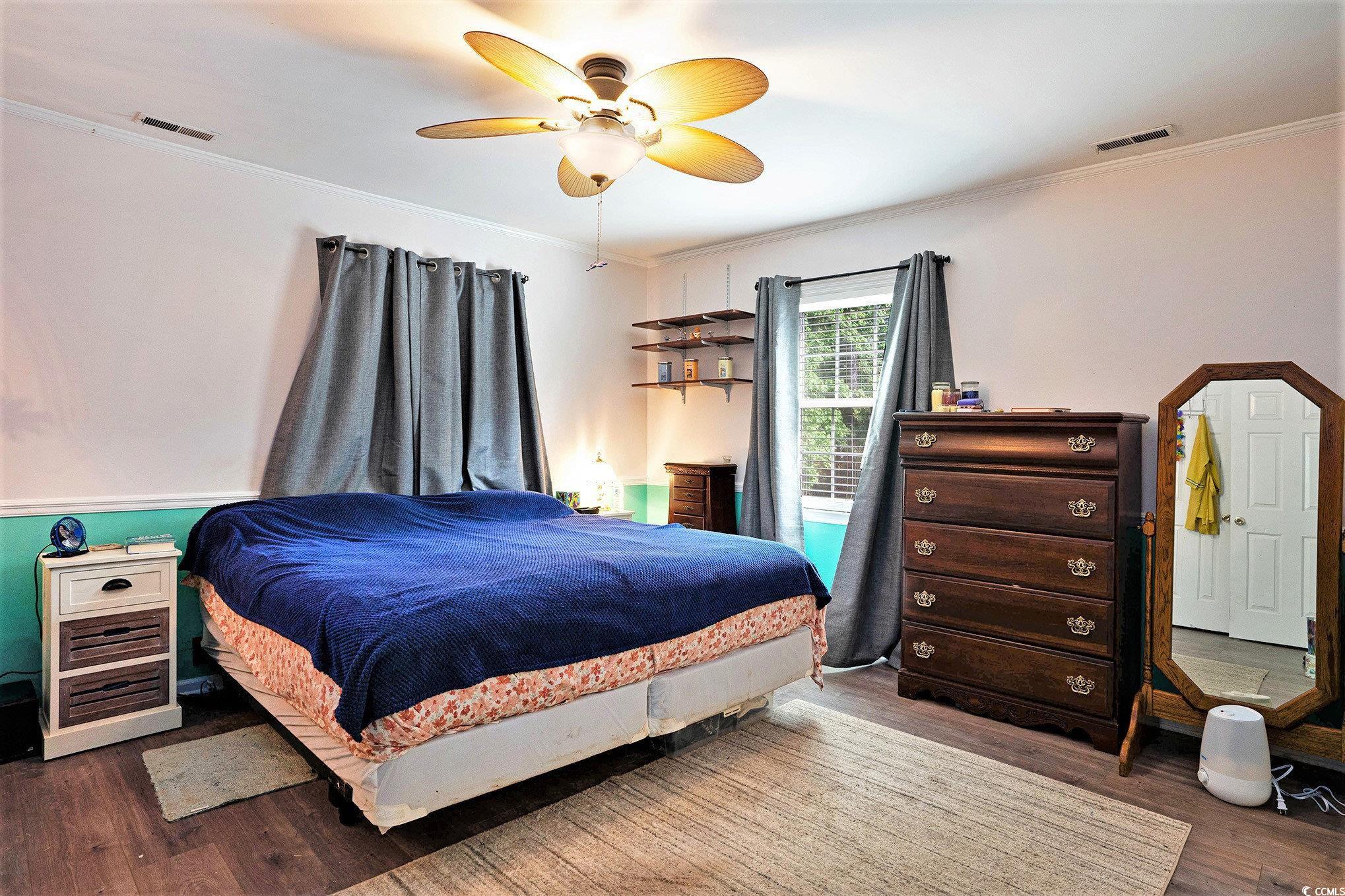 238 Robin Drive Georgetown, SC 29440 - Photo 13 of 31 Bedroom with wood finished floors, ornamental molding, and a ceiling fan