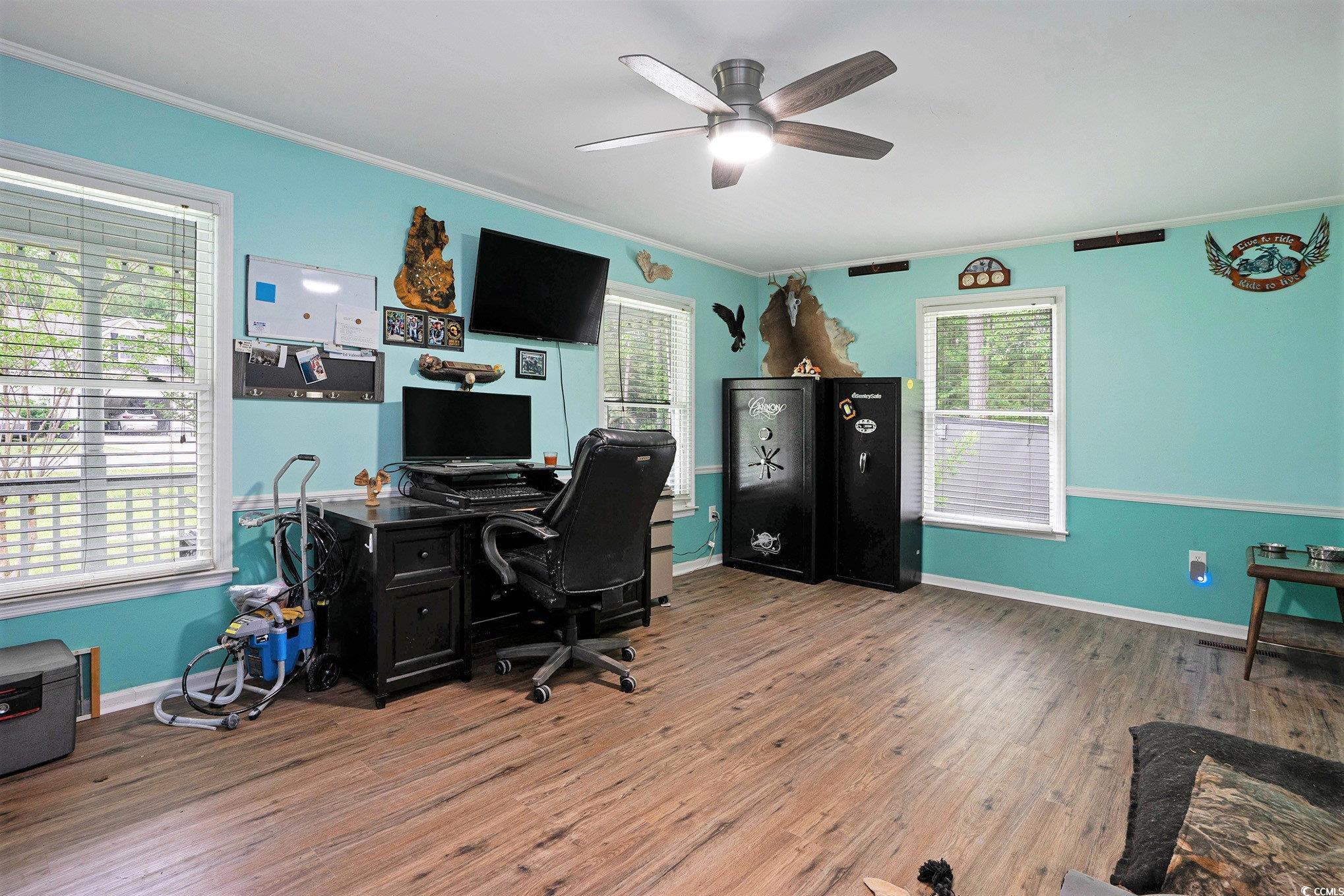 238 Robin Drive Georgetown, SC 29440 - Photo 17 of 31 Office area with plenty of natural light, crown molding, ceiling fan, wood finished floors, and baseboards