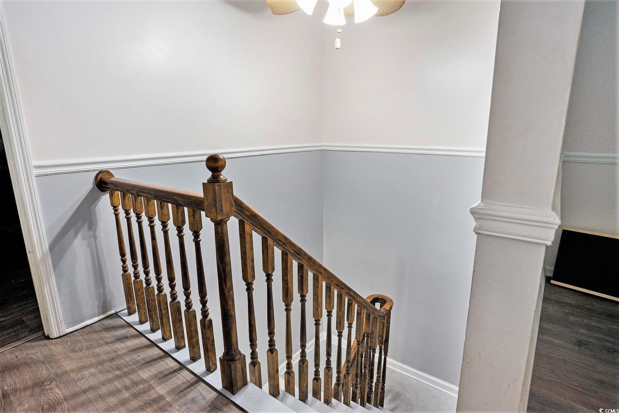 238 Robin Drive Georgetown, SC 29440 - Photo 25 of 31 Stairway featuring wood finished floors and a ceiling fan